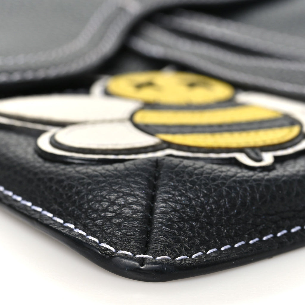 X KAWS Grained Calfskin Bee Saddle Pouch Black